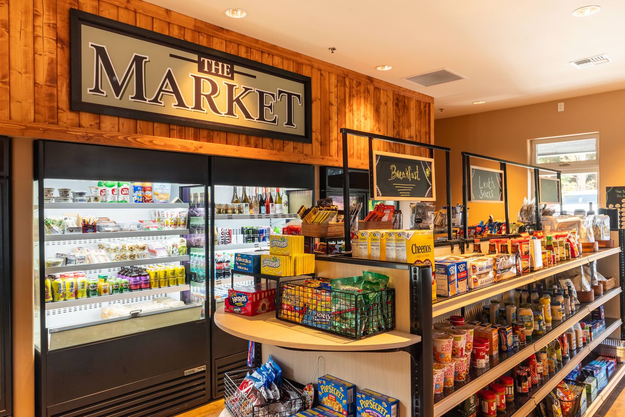 Inside The Market at Grass Valley RV Resort — coolers, snack shelves, and grab-and-go essentials