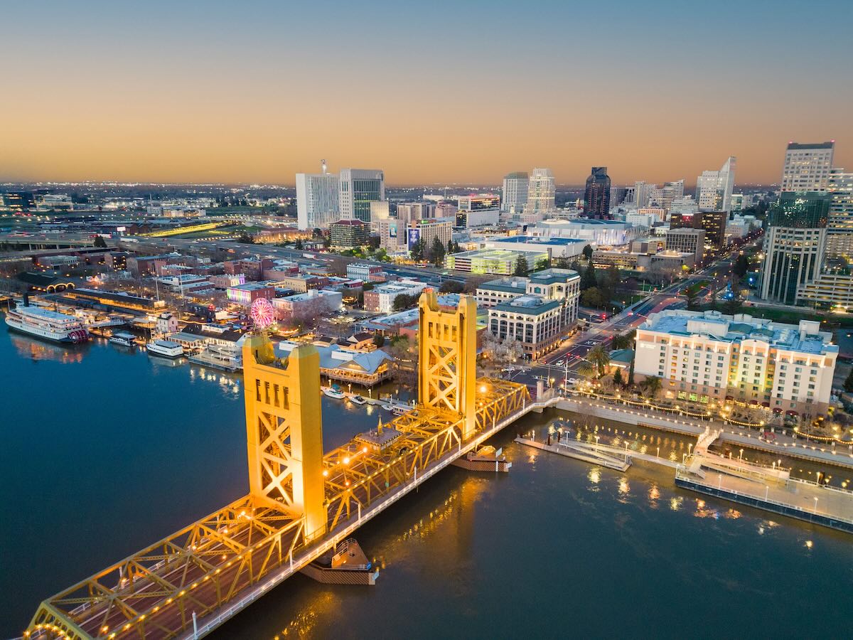 Aerial photo of the Tower Bridge and Old Sacramento waterfront on a fall evening
